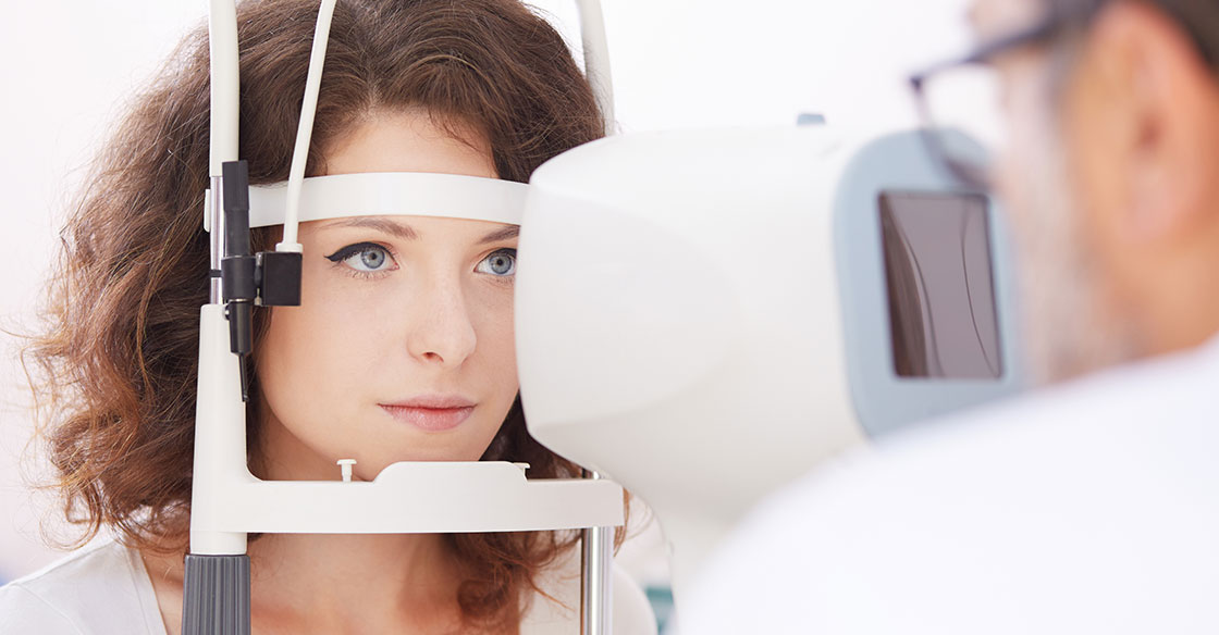 Woman examined for the early signs of astigmatism