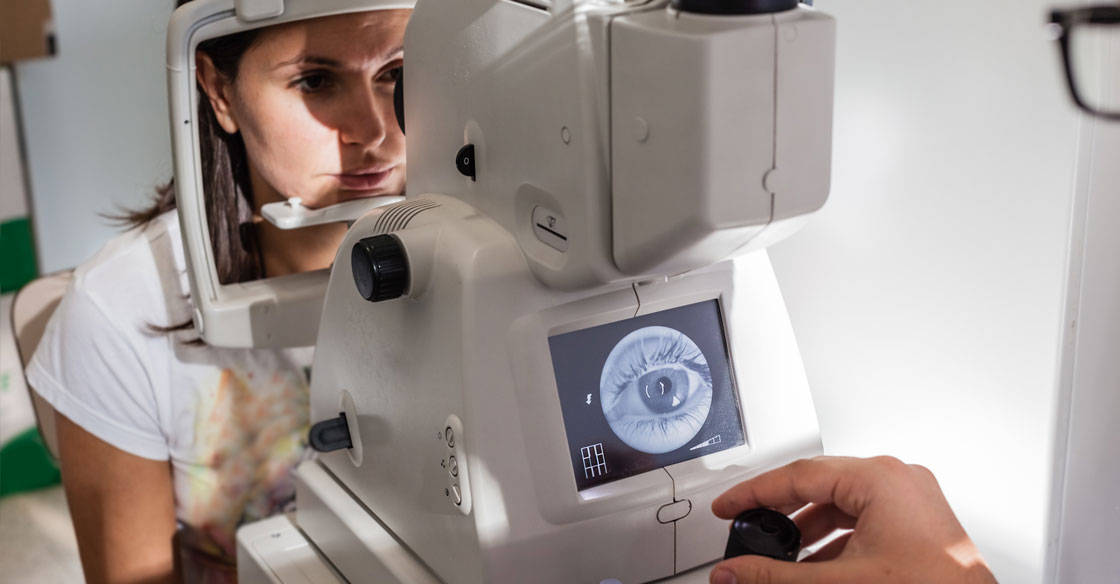 woman having her eye examined for a vision impairment