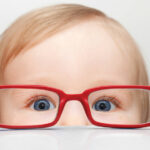 Infant Vision - Child looking though the opposite side of glasses