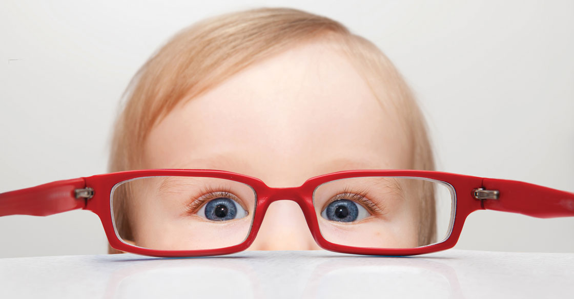 Infant Vision - Child looking though the opposite side of glasses