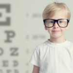 Vision Problems - Young Boy wearing glasses to big for his face