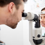 An Eye Doctor performing a slit lamp exam on a patient