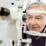 Older man having his eyes examined