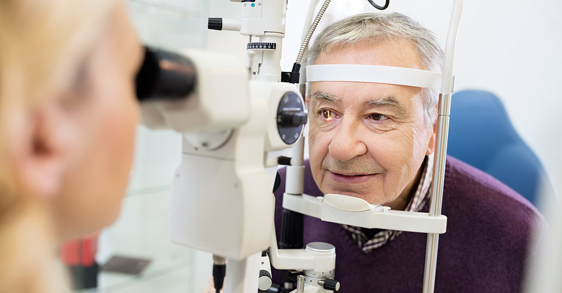 Older man having his eyes examined