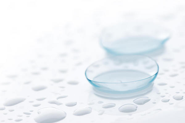 close up of contact lenses with water droplets